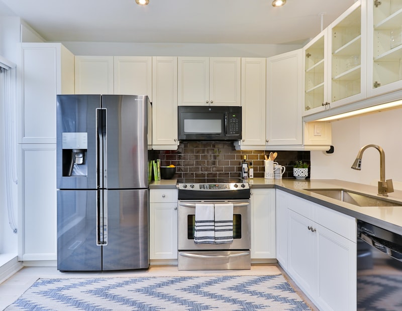 Kitchen with a fridge, cooker and microwave