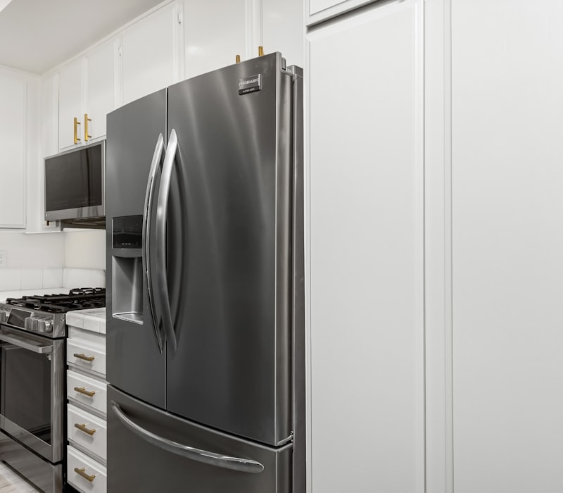 Kitchen with a fridge and stainless steel appliances