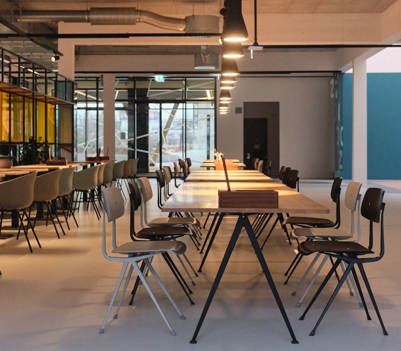 Restaurant dining area with long tables and chairs