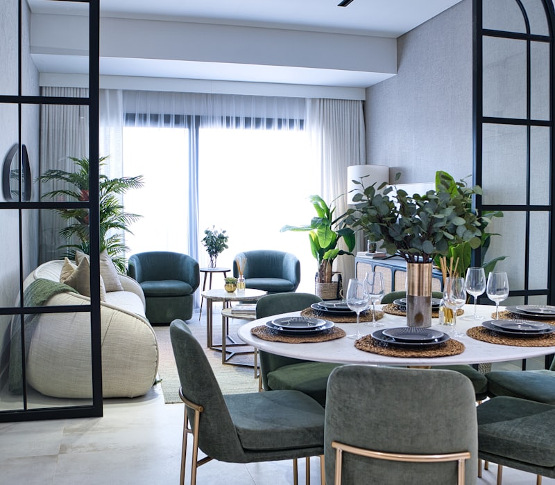 Living room with a sofa and armchairs ready for collection