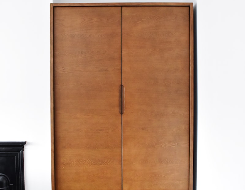Wooden wardrobe with panelled doors